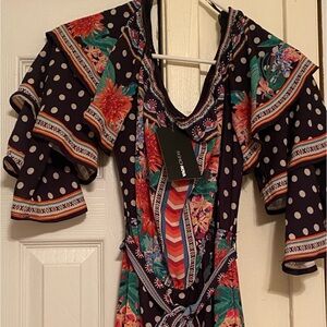 Floral jumpsuit. Never worn. Great for a dinner date.